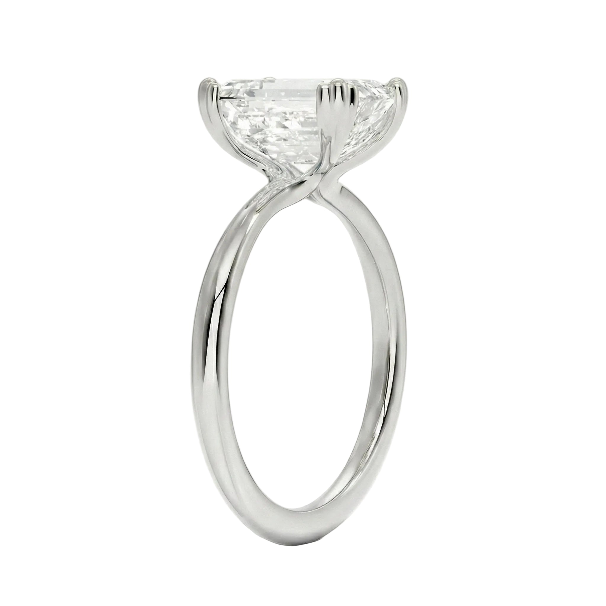Close-up of a D-color VVS1 emerald cut moissanite in a secure double-prong gold setting.