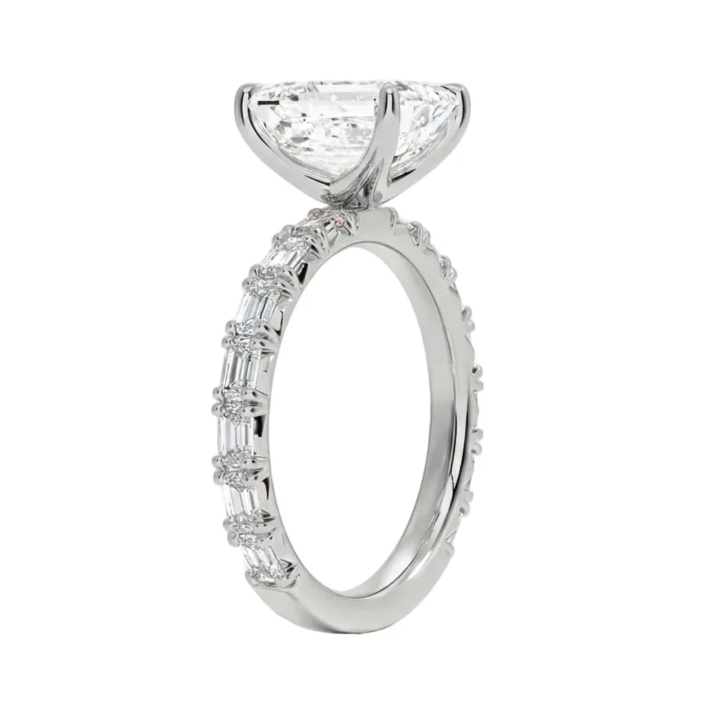 Detailed side view of an emerald cut eternity ring showing professional prong settings and GRI certified stone quality