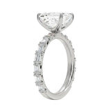 Detailed side view of an emerald cut eternity ring showing professional prong settings and GRI certified stone quality