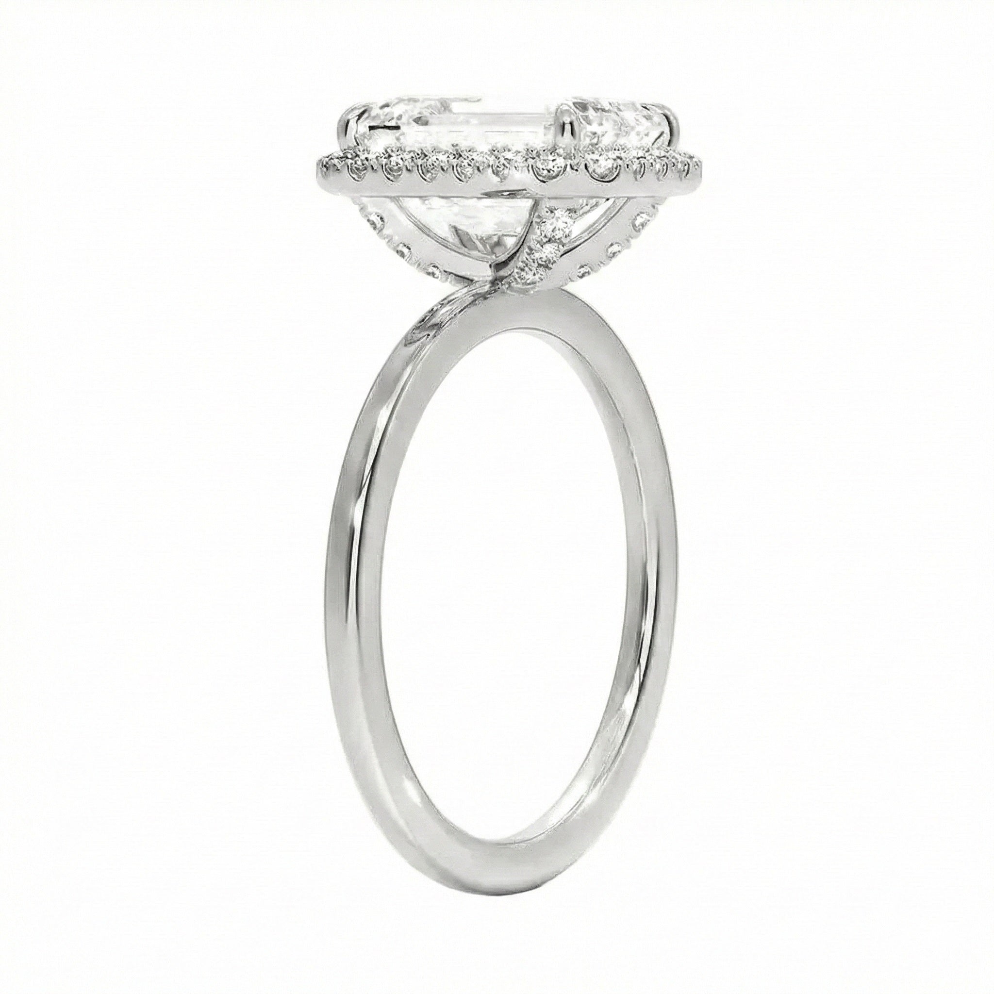 Silver ring with a diamond halo on a white background