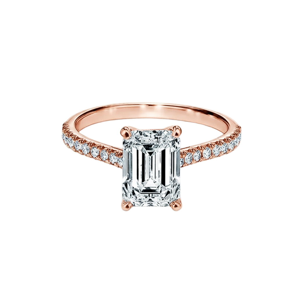 Close-up of a D-color VVS1 emerald cut moissanite in a secure cathedral gold setting.
