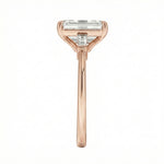 Rose gold ring with a rectangular diamond on a white background ApoloGem Engagement ring Emerald cut rose gold
