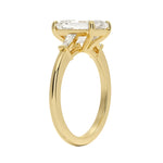 High set emerald cut ring with tapered baguettes side profile details ApolloGem