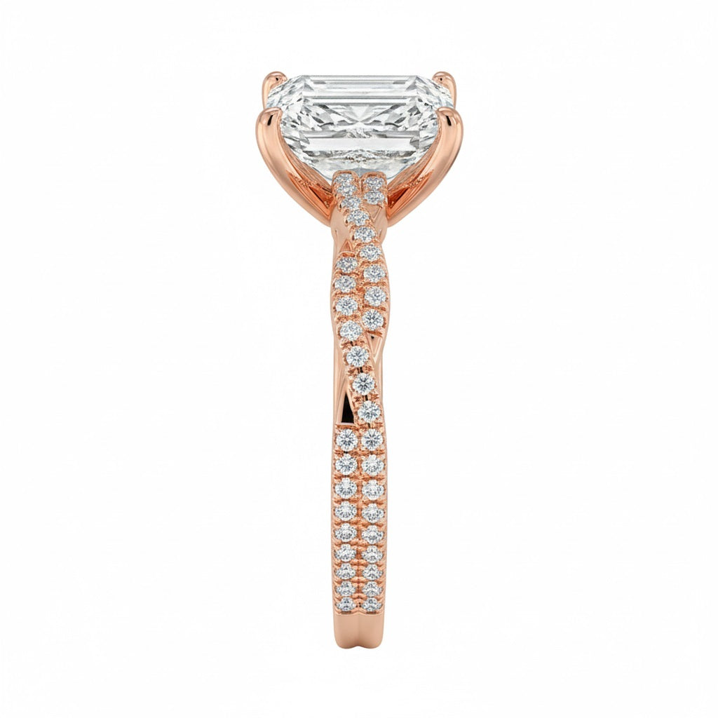 Top-down view of a D-color VVS1 emerald stone in a rose gold infinity twist setting.
