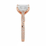 Top-down view of a D-color VVS1 emerald stone in a rose gold infinity twist setting.