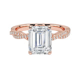 Four-claw emerald cut moissanite engagement ring with a pavé infinity twist vine band in rose gold ApolloGem.