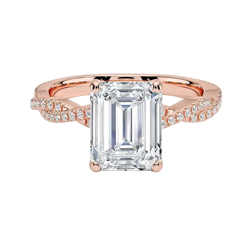 Four-claw emerald cut moissanite engagement ring with a pavé infinity twist vine band in rose gold ApolloGem.