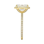 Top-down view of the emerald cut stone in a yellow gold double halo setting