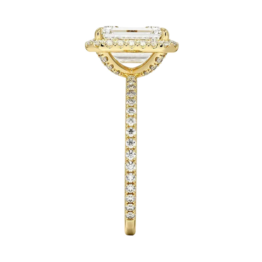Top-down view of the emerald cut stone in a yellow gold double halo setting