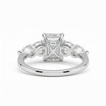 Silver ring with a diamond on a white background