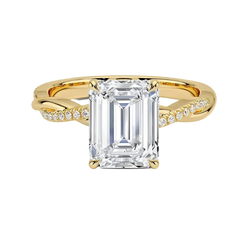 Four-claw emerald cut moissanite engagement ring with a single pavé vine twist band in yellow gold ApolloGem.