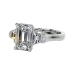 Symmetrical top-down view of the triple emerald-cut moissanite masterpiece in white gold.