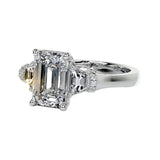 Symmetrical top-down view of the triple emerald-cut moissanite masterpiece in white gold.