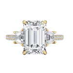 Luxury emerald cut moissanite engagement ring with trapezoid side stones and triple-row pavé band in yellow gold ApolloGem.