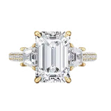 Luxury emerald cut moissanite engagement ring with trapezoid side stones and triple-row pavé band in yellow gold ApolloGem.