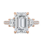 Detailed side view of an emerald cut ring showing a secret hidden halo and pavé-set bridge with GRI certified stones.