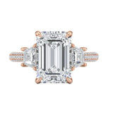 Detailed side view of an emerald cut ring showing a secret hidden halo and pavé-set bridge with GRI certified stones.