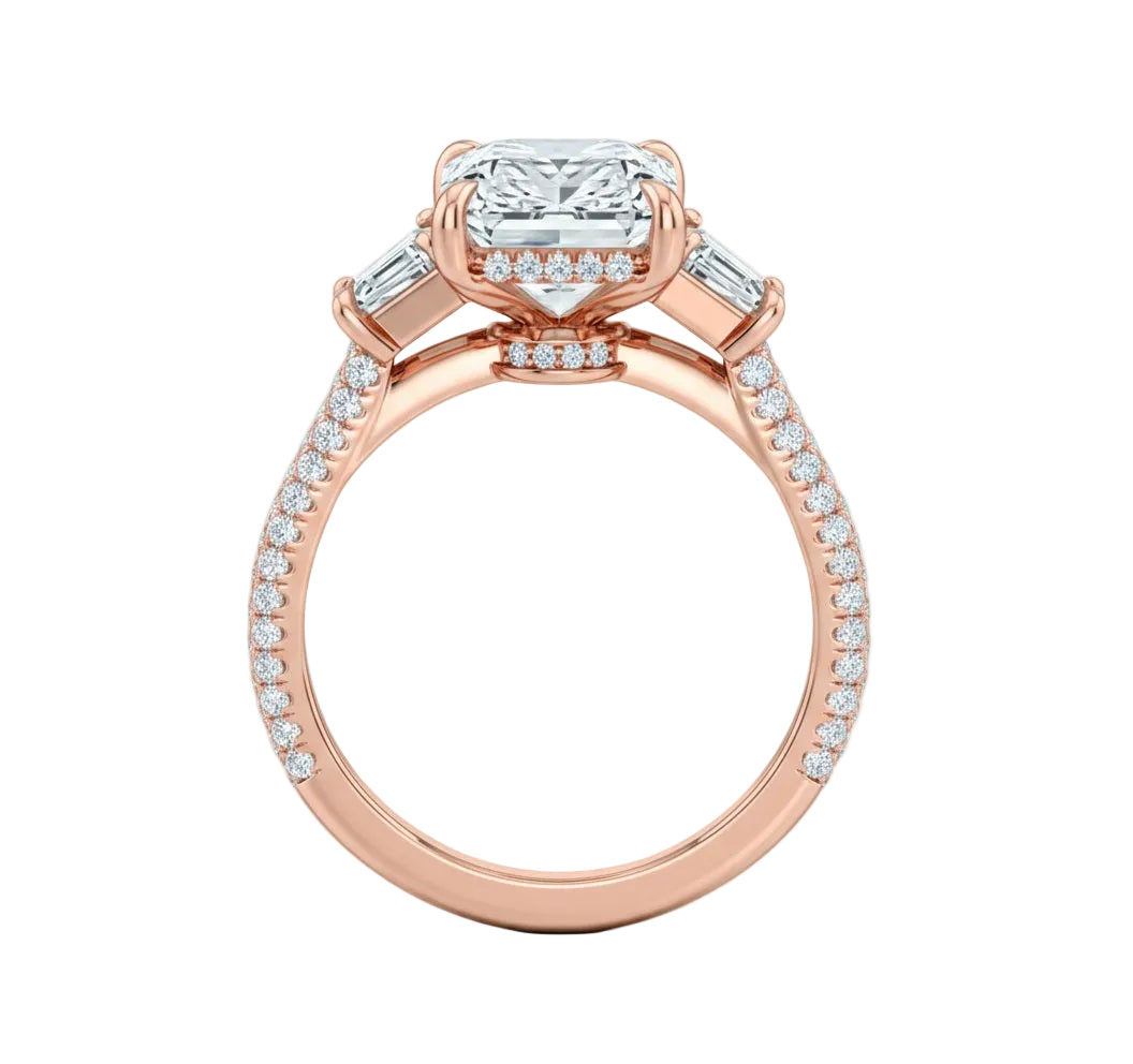 Top-down view of a symmetrical emerald and trapezoid moissanite ring on a luxurious triple-row pavé gold band.