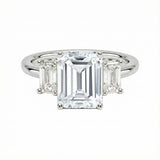 Grand emerald cut moissanite trilogy engagement ring in white gold ApolloGem.