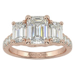 Emerald cut moissanite trilogy engagement ring with a pavé-set rose gold band ApolloGem.
