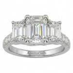 Emerald cut moissanite trilogy engagement ring with a pavé-set white gold band ApolloGem.