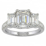 Emerald cut moissanite trilogy engagement ring with a pavé-set white gold band ApolloGem.