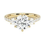 Round brilliant moissanite engagement ring yellow gold pavé band three stone style