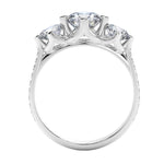 Top-down view of a D-color VVS1 graduated three-stone round moissanite ring with accent stones.