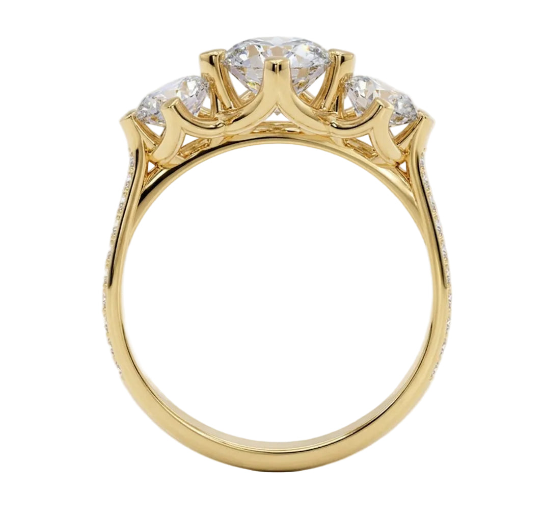 Top-down view of a D-color VVS1 graduated three-stone round moissanite ring with accent stones.