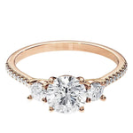Rose gold ring with a diamond on a white background