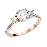 Round brilliant moissanite trilogy engagement ring with pavé-set rose gold band ApolloGem.