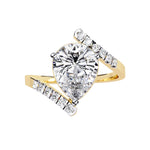 Modern floating pear cut solitaire engagement ring with an open-shank bypass in yellow gold ApolloGem.