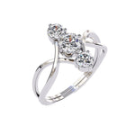 Close-up of D-color VVS1 round moissanites integrated into a decorative infinity setting.