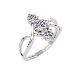 Close-up of D-color VVS1 round moissanites integrated into a decorative infinity setting.
