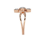 Rose gold ring with three gemstones on a white background