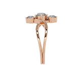 Rose gold ring with three gemstones on a white background