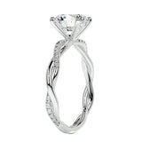 Close-up of a high-quality D-color VVS1 round brilliant moissanite center stone on a shimmering pavé twisted shank.