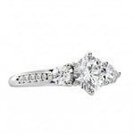 Detailed side view showing the architectural baskets and shimmering pavé shank of the Legacy ring.