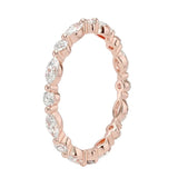 Top-down view of a D-color VVS1 alternating marquise and round stone full eternity wedding band in rose gold.
