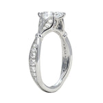 Close-up of the tapered pavé band and six-prong marquise mount