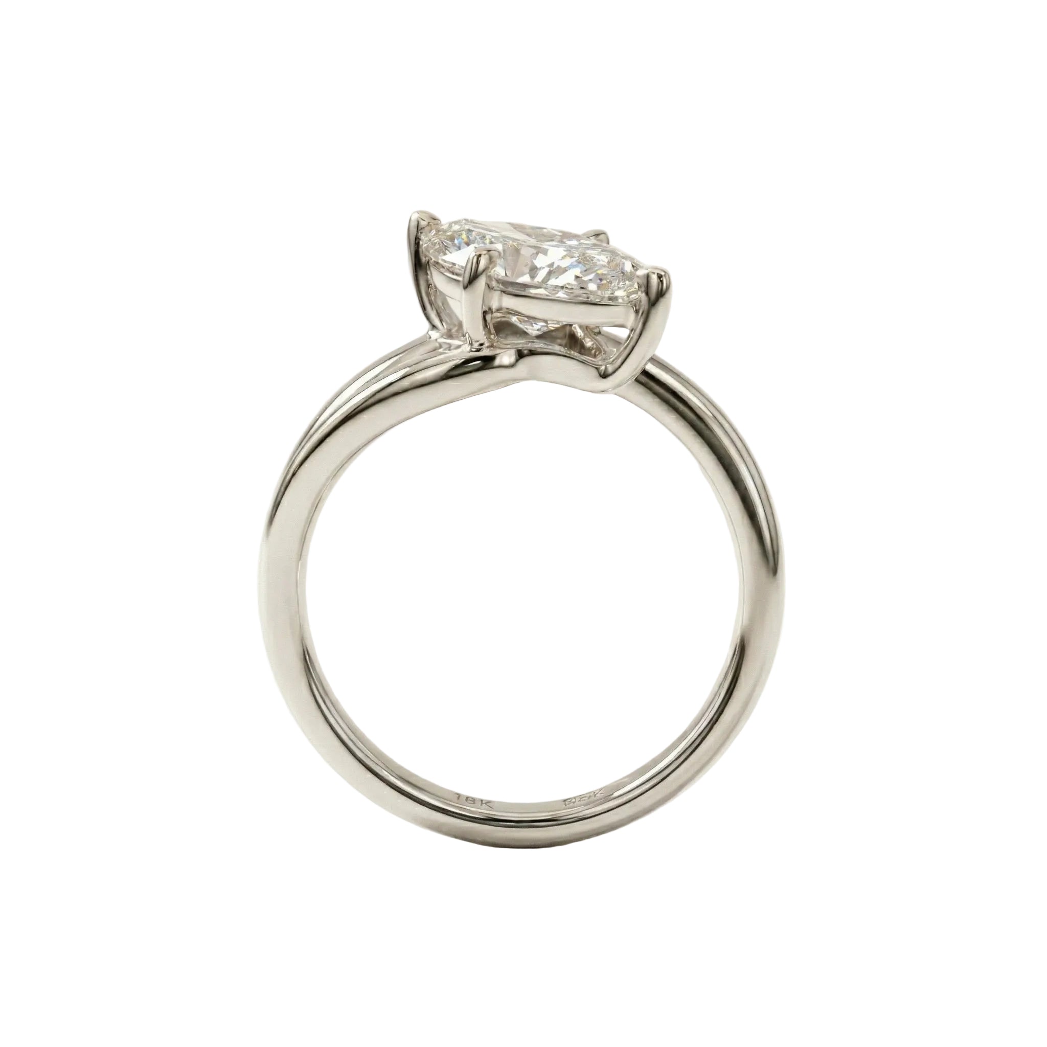 Top-down view of a D-color VVS1 marquise brilliant moissanite in a white gold solitaire setting.