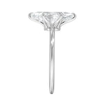 Symmetrical top-down view of a marquise moissanite solitaire in a polished white gold setting.
