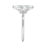 Symmetrical top-down view of a marquise moissanite solitaire in a polished white gold setting.