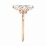 Symmetrical top-down view of a marquise moissanite solitaire in a polished rose gold setting.