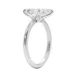 Detailed side view of the marquise solitaire showing the six-prong crown architecture and round band.