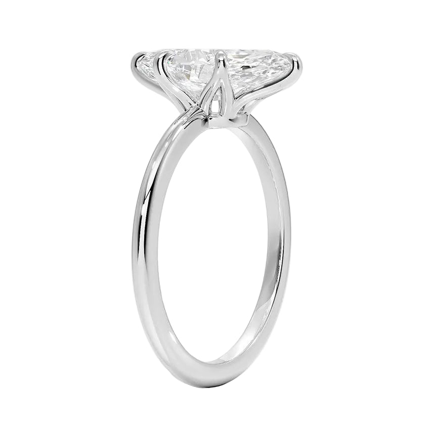 Detailed side view of the marquise solitaire showing the six-prong crown architecture and round band.