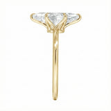 Symmetrical top-down view of a marquise moissanite solitaire in a polished yellow gold setting.