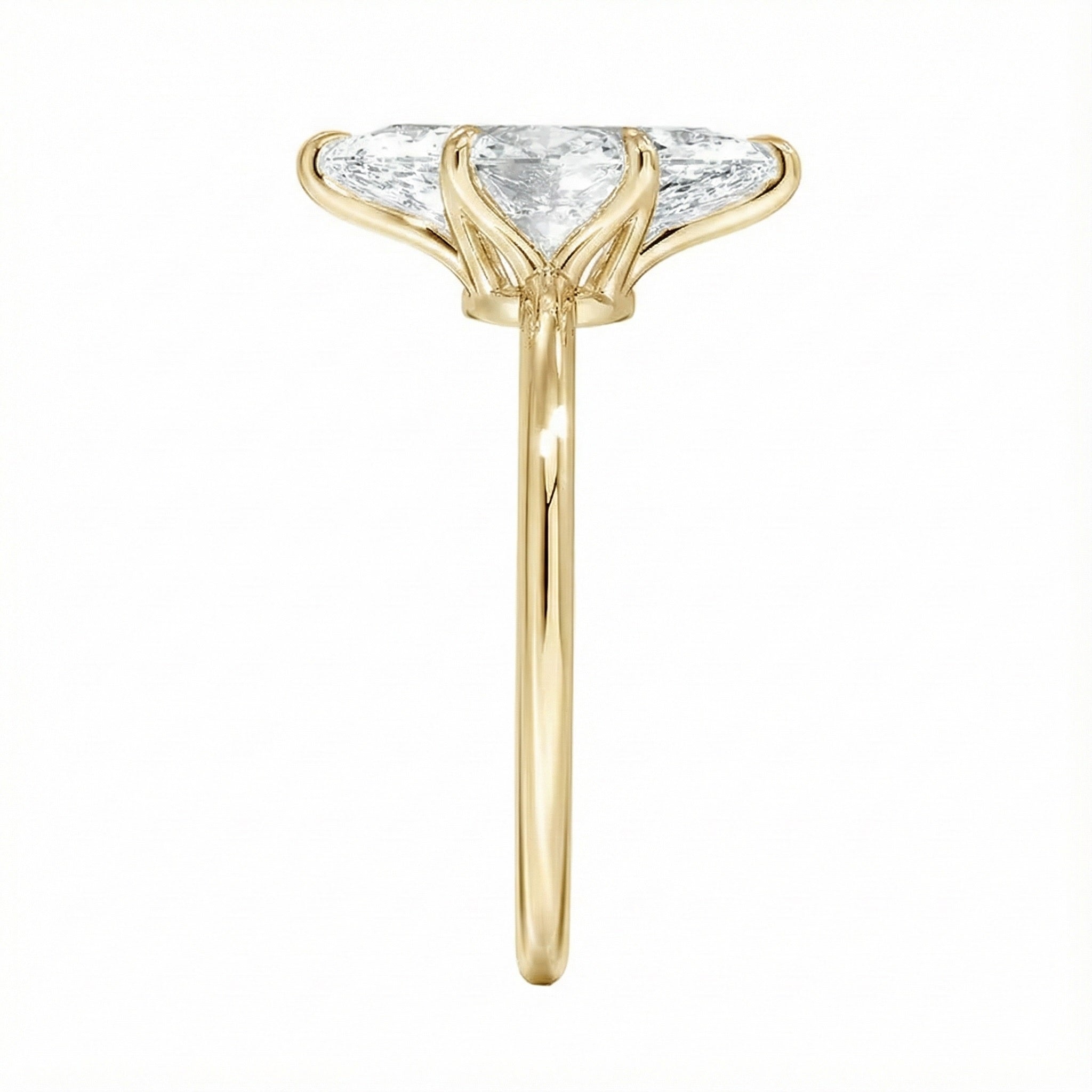 Symmetrical top-down view of a marquise moissanite solitaire in a polished yellow gold setting.