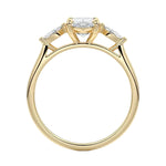Top-down view of a symmetrical marquise-only three-stone ring on a polished yellow gold comfort-fit band.