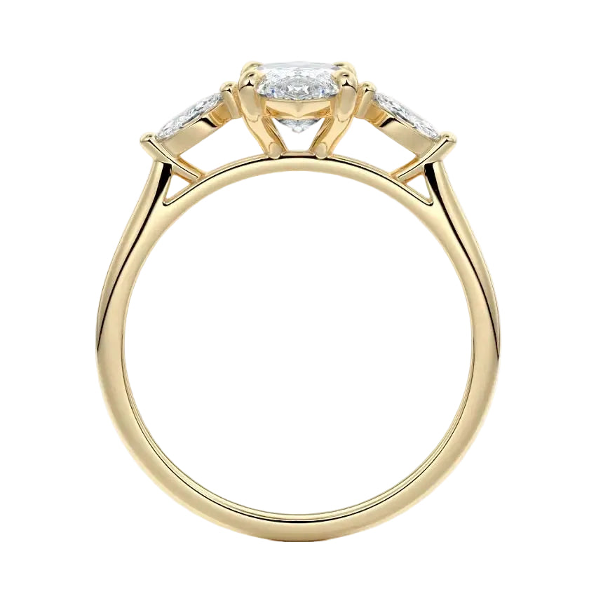 Top-down view of a symmetrical marquise-only three-stone ring on a polished yellow gold comfort-fit band.